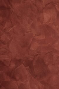 a red background with a rough texture of paper
